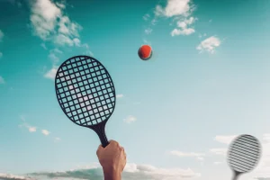 beach-tennis-racquet-in-air-hitting-ball