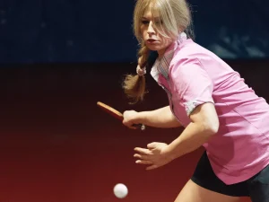 woman hitting ball, pink shirt