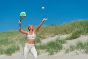 woman-serving-a-beach-tennis-ball