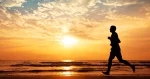 silhoutte of man running on the beach sunset 6480f44c86f9a