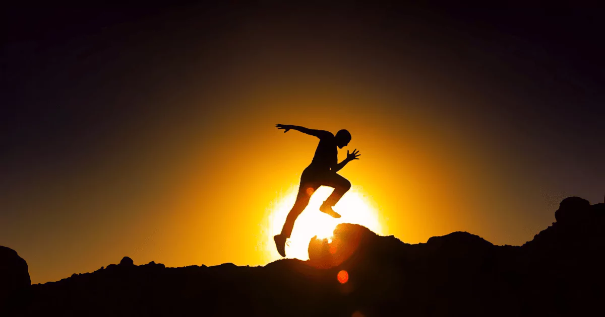 silhoutte of man running over hill sunset sky 6489c15458791