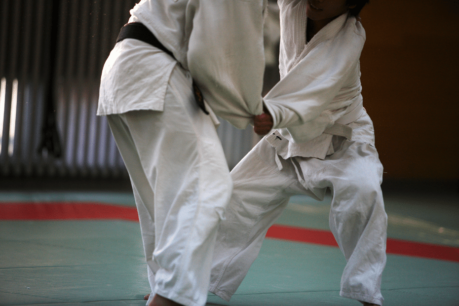 A person in a white martial arts outfit