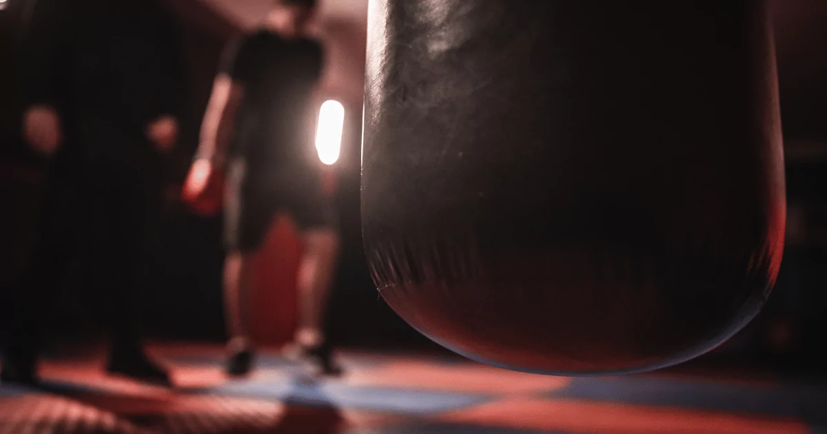 A close up of a punching bag in a kickboxing ring