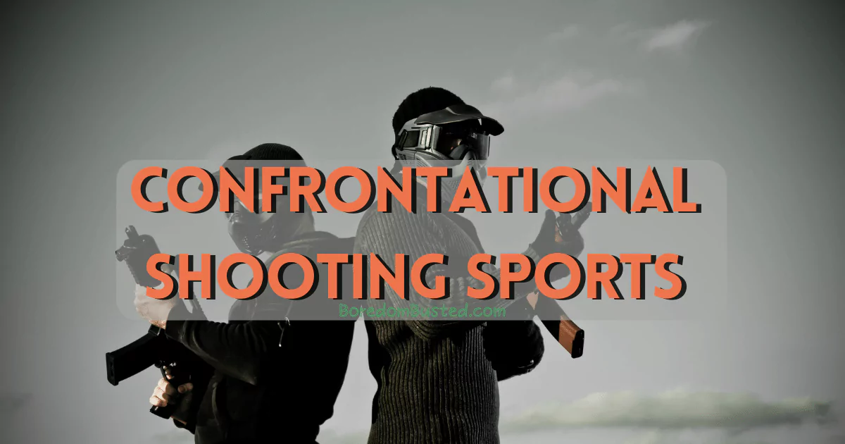 Two people engaged in confrontational shooting sports with airsoft guns / helmets
