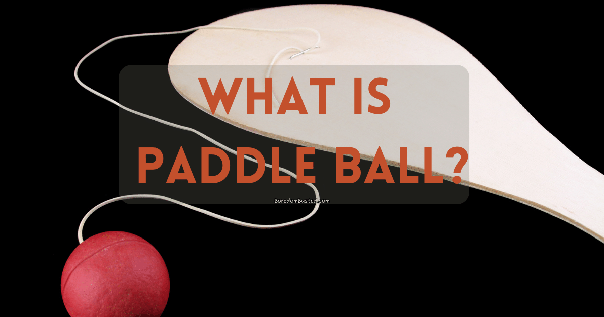 paddle ball, featured image. "what is paddle ball?". black background with wooden paddle and red ball on string