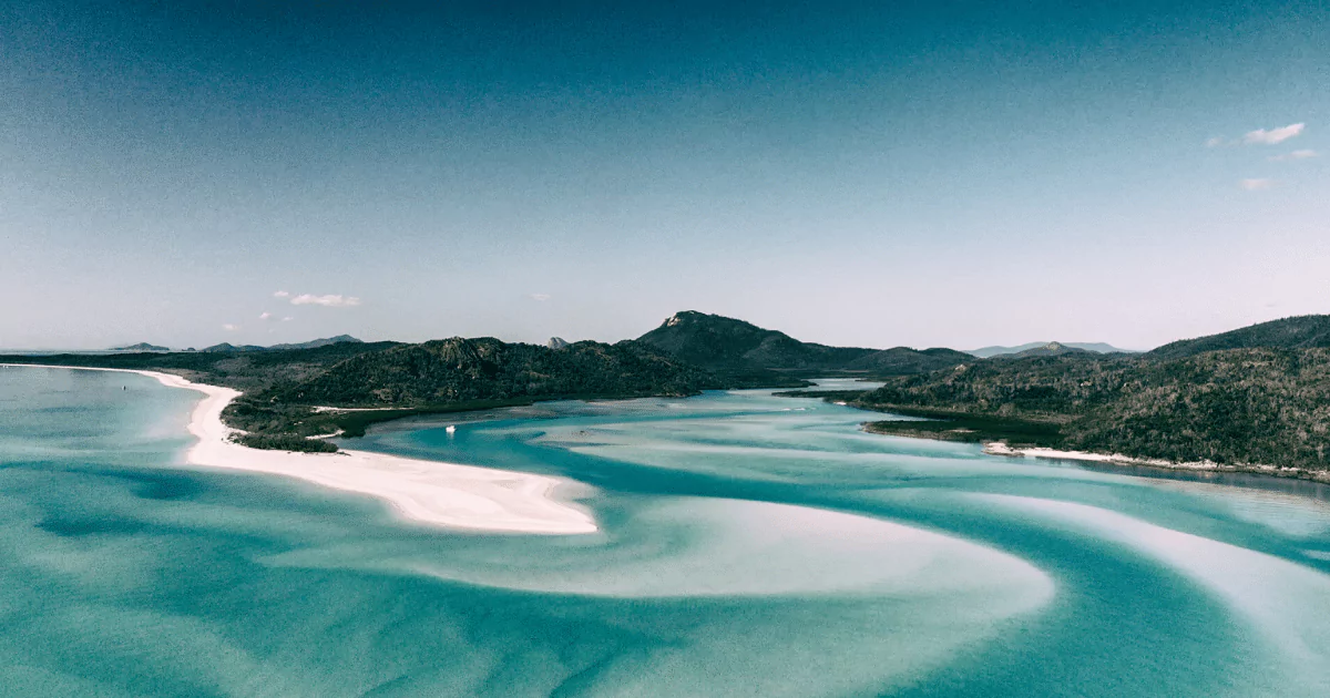 An aerial view of whitehaven beach, whitsunday islands featured in "What is a Beach? An Ultimate 101 to Beach Types (2023)