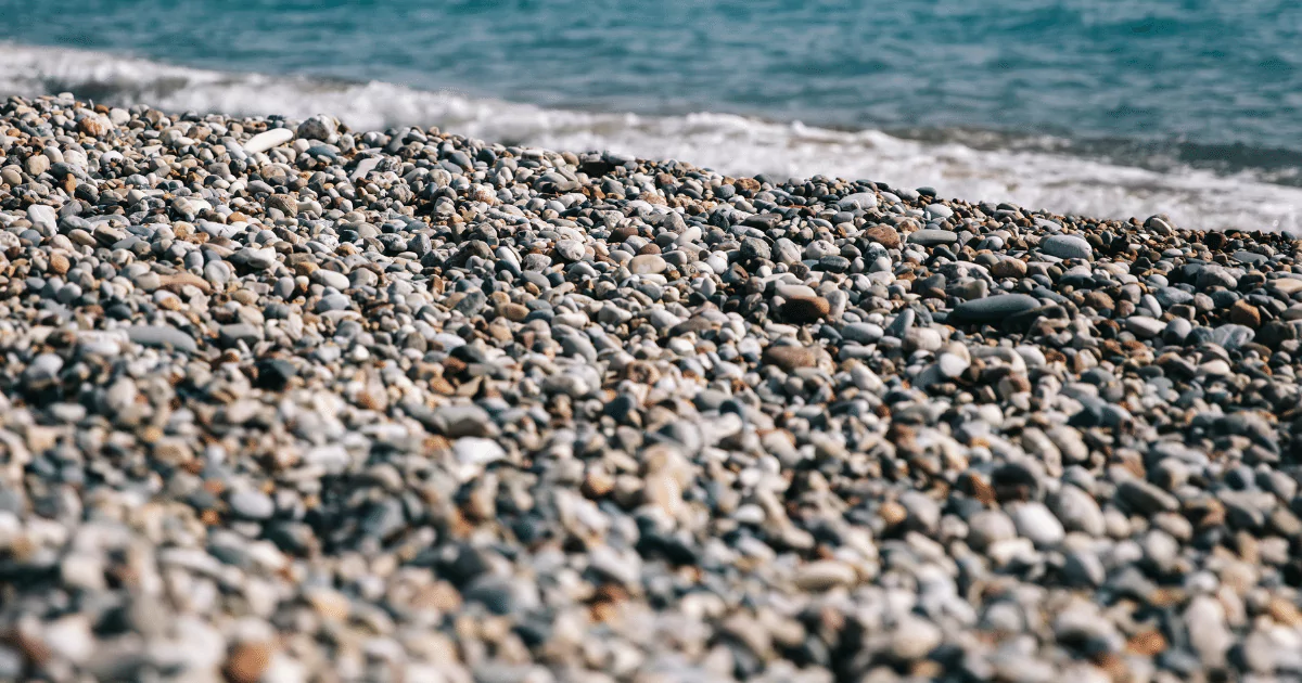 A close up of a beach with pebbles